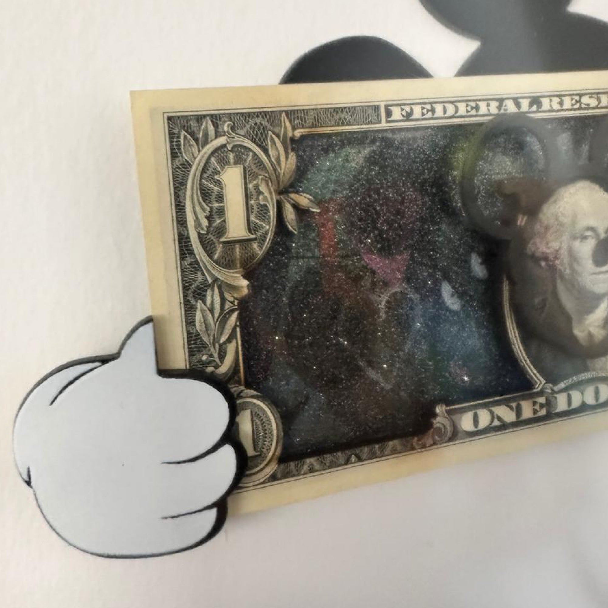 Mickey thumbs dollar